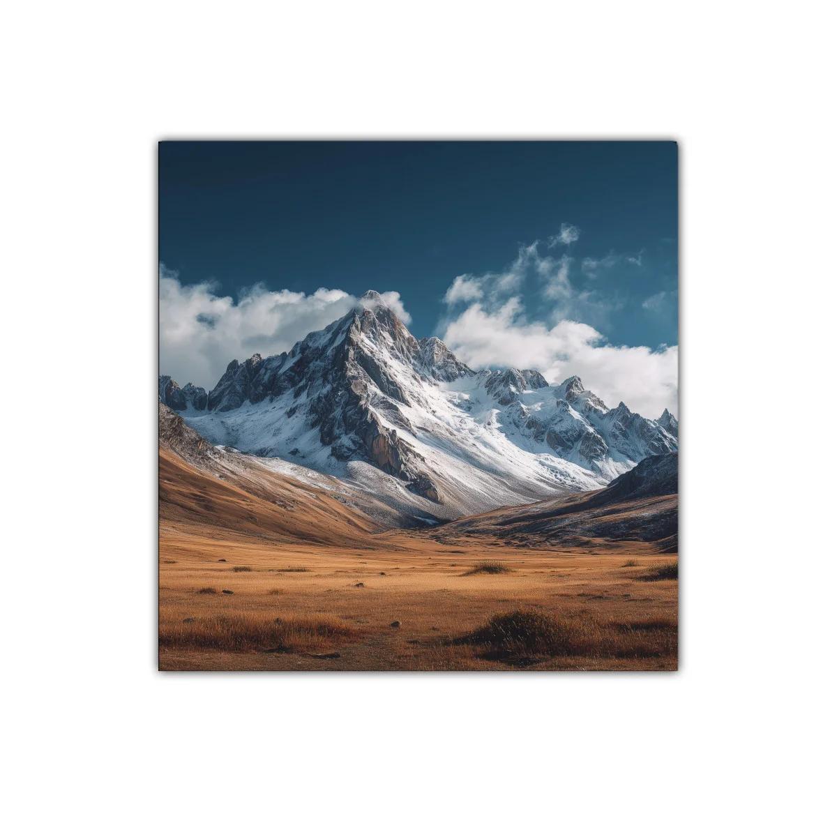 Montañas nevadas con cielo azul y pradera dorada — miniatura 1