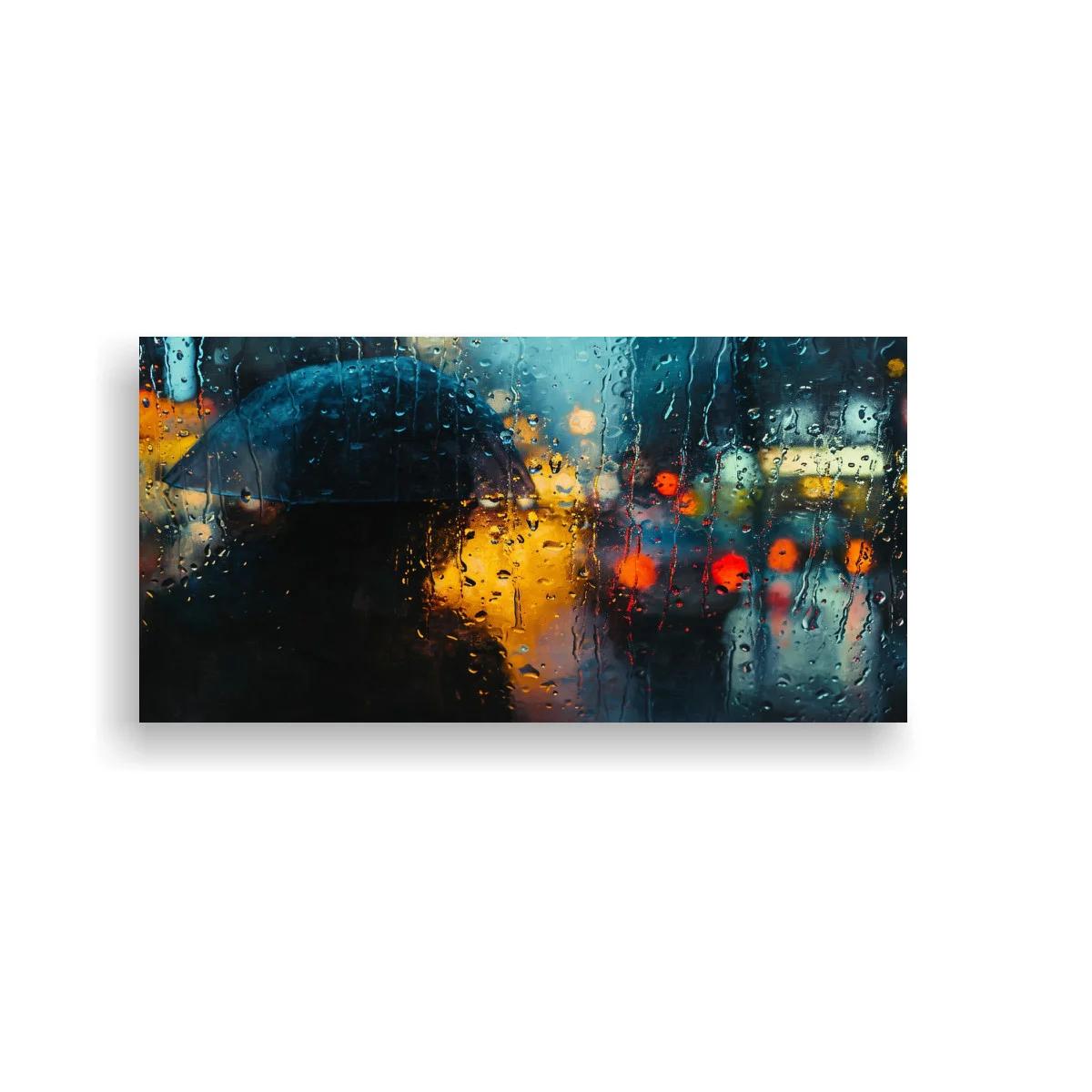 Cuadro persona con paraguas negro bajo la lluvia y luces borrosas — imagen principal